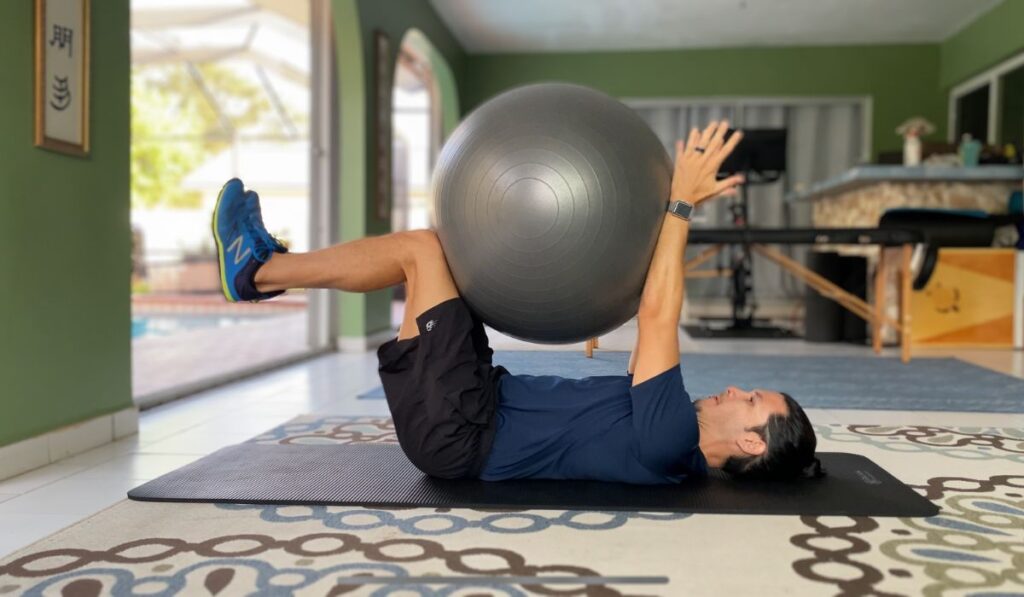 The dead bug with stability ball is an exercise that strengthens the core. To squeeze the ball you must flex you abs which creates a greater extension force to fight.