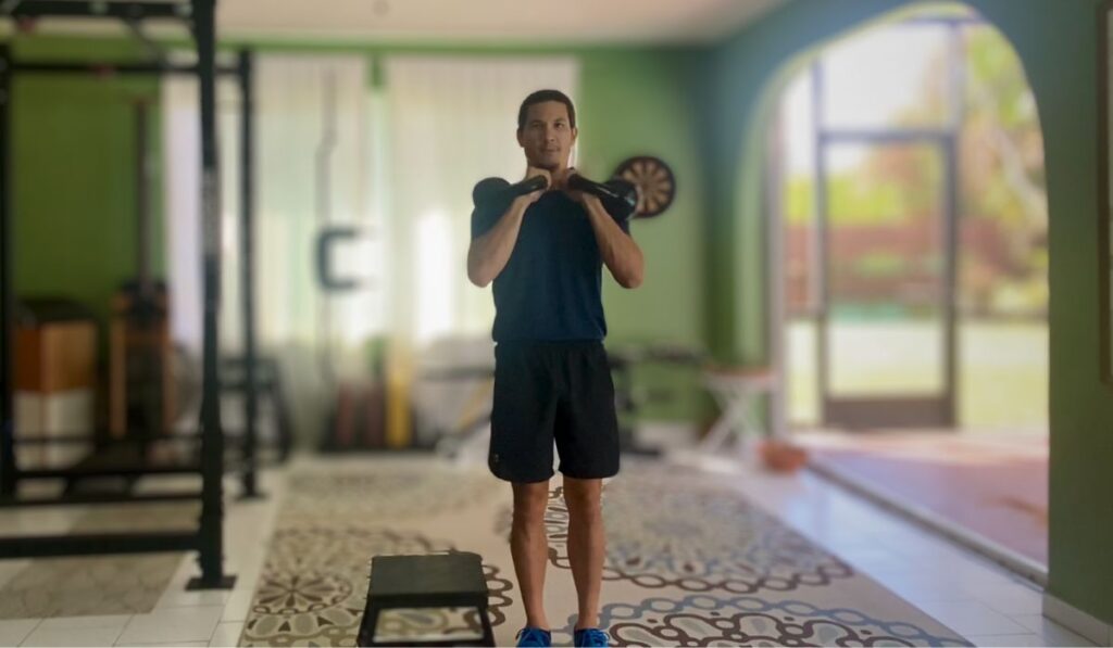 The Kettle bell front rack position is a style of holding a weight. This style places the weight in front of the body creating a flexion stimulus your core will have to fight when performing an exercise.