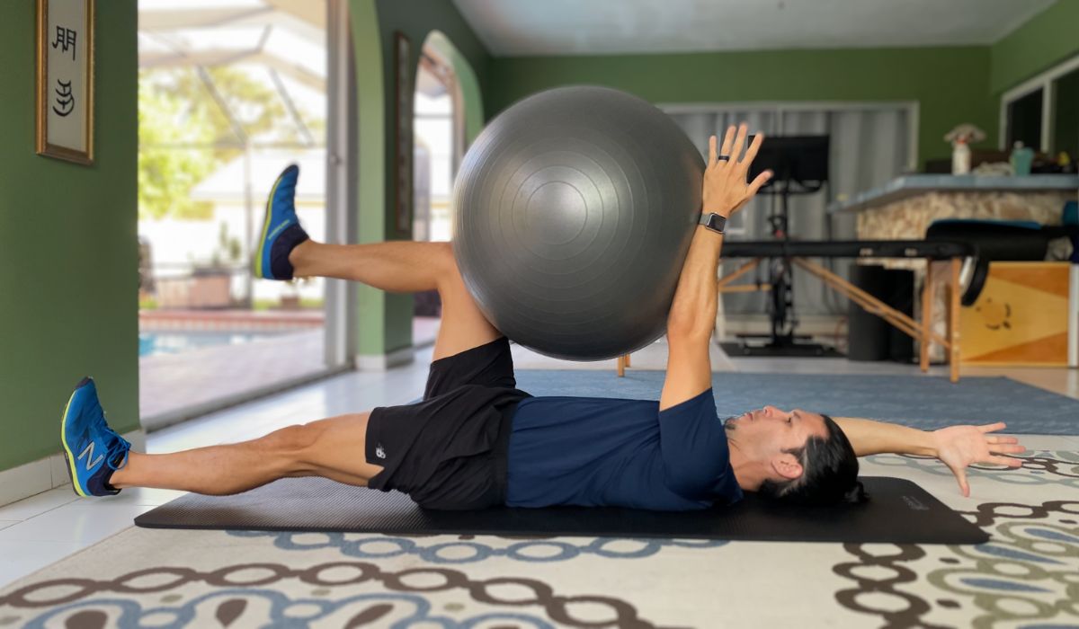 The dead bug with stability ball is an exercise that strengthens the core. To squeeze the ball you must flex you abs which creates a greater extension force to fight.